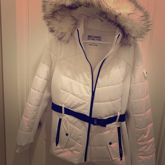 white ski coat with fur hood